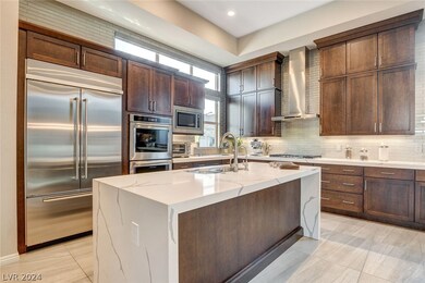 Gourmet Kitchen with Waterfall Quartz Counter Tops