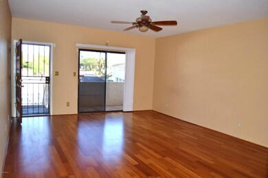 Immaculate living room w/fan/patio