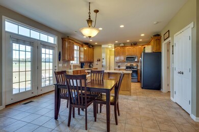 The kitchen has tile floors and a lot of natural light!