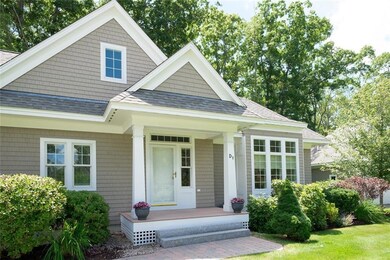 Welcoming front porch with brick...