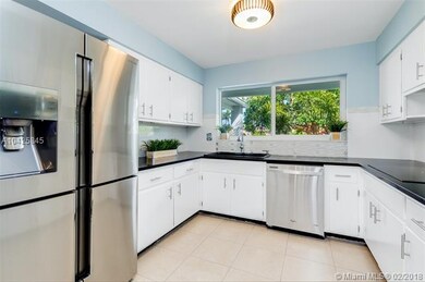 Kitchen featuring high end 4 door Samsung refriger