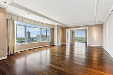 The living room features large walls for art and a