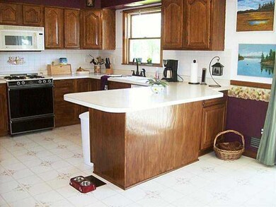 Kitchen. The kitchen has solid wood cabinetry, ple