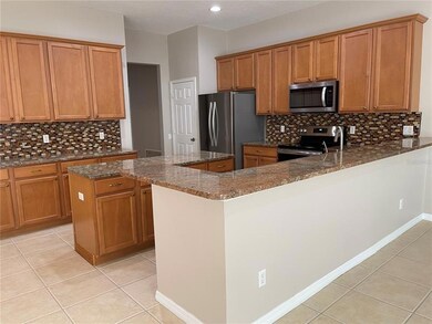 Kitchen with stainless steel appliances.