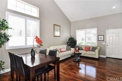 Formal Living Room with Formal Dining Area, Vaulted Ceilings, High Transom Windows for Lots of Natural Light, and Plantation Shutters