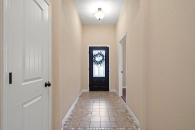 Doorway to outside with a textured wall and light
