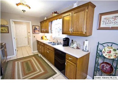 Great kitchen with tile floors and tons of cabinet