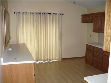 KITCHEN WITH EATING SPACE AND PATIO DOORS LEADING 