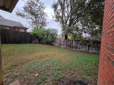 View of fenced backyard