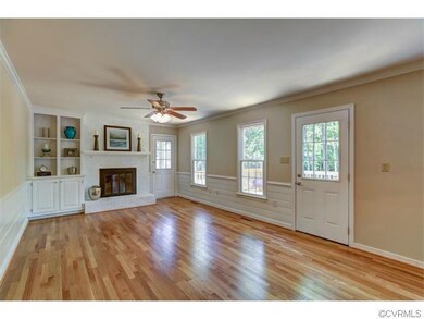 Family room with new hardwood floor and wood burni
