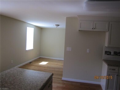 Kitchen looking into the Dining Room.  Hardwood floors are also located in DR.