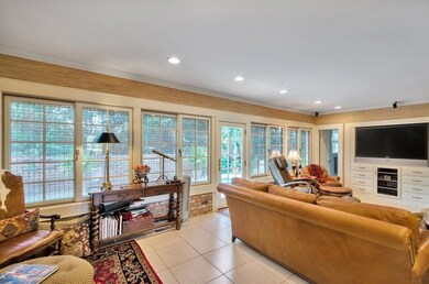 Light and bright family room overlooks the pool