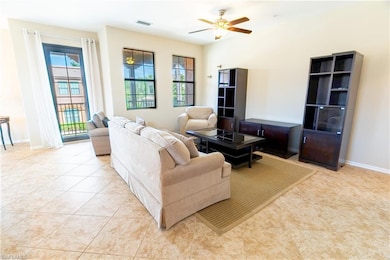 Living area featuring light tile patterned floors,
