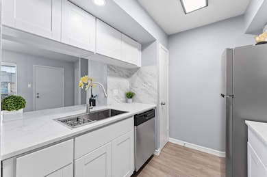 The kitchen boasts a new modern sink and faucet.