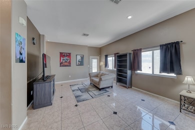 Living area with light tile patterned floors and r