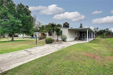 Nice manufactured home with carport, lanai and she