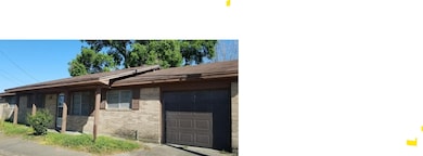 Single-story brick home with a two-car garage, fro