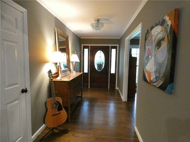 Steps to front porch lead to entryway.