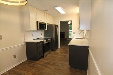Kitchen with stainless steel appliances, a sink, d