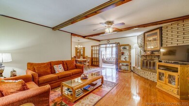 Inviting living room with beamed ceilings and wood