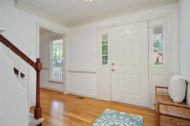 Gleaming hardwood front foyer.