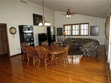 Great Room. 5 Windows covered with venetian blinds