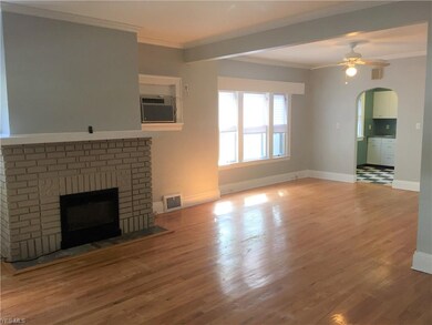 A Freshly Painted Interior of Neutral Toned walls & high gloss white base/ceiling trim, accent the Hrdwd Flrs.