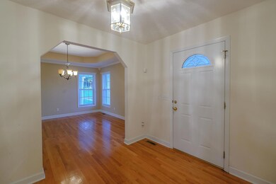 Entry foyer with hardwood floor.  Opens to dining room & great room.
