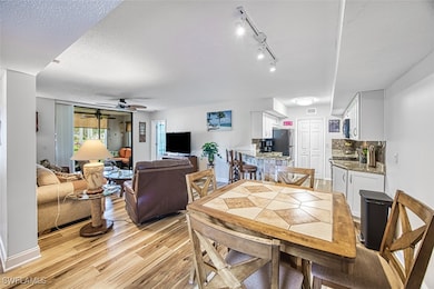 Open floorplan kitchen, dining, and living area. G
