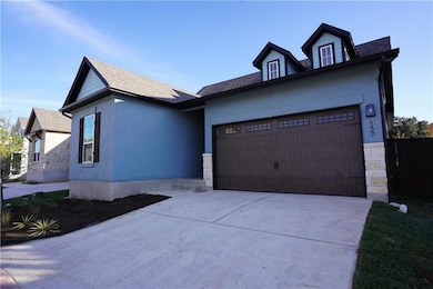View of front of house with an attached garage, d