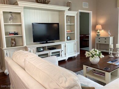 Living room featuring dark hardwood / wood-style f