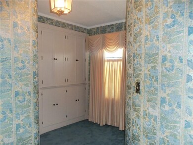 Upstairs linen storage with round wall