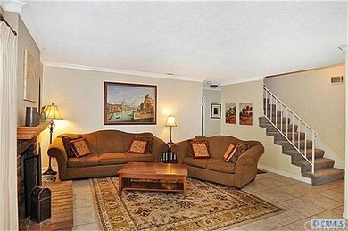 Another view of family room and stairway to second