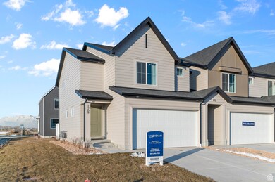 View of front of home featuring a garage, concrete driveway, roof with shingles, and a mountain view
