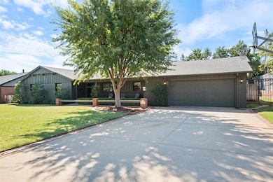 Single story home featuring a garage and a front l