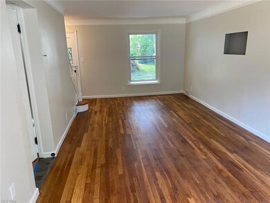 Living room/dining room with view to front yard