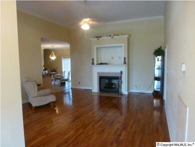 LOOKING INTO THE SPACIOUS FAMILY ROOM W/HARDWOOD FLOORS