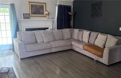 Living room featuring wood finished floors