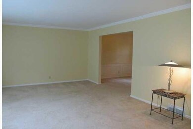 Dining Room. Bright, sunny formal dining has detailed chair rail.