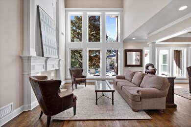 Living room featuring ornamental molding, decorati
