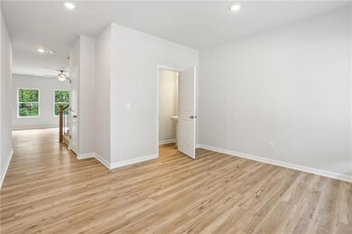 Unfurnished room featuring light wood-style floors, baseboards, recessed lighting, and a ceiling fan