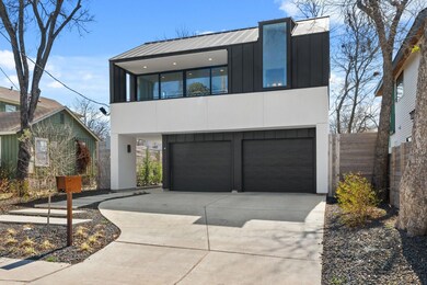 Modern home with board and batten siding, drivewa