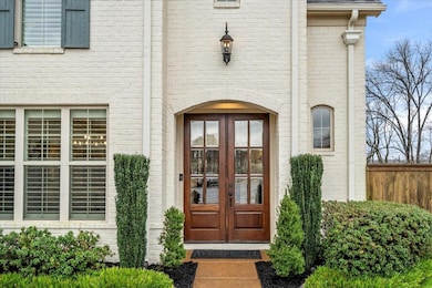 Doorway to property featuring french doors