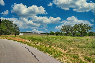 View of asphalt road with a view of rural / pasto