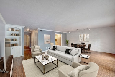 Virtually staged. Family Room with accent brick wa