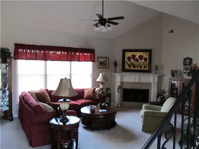 The 21x17 family room has vaulted ceilings, gas lo