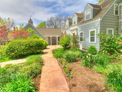 The stone pathway leads to the front door showing 