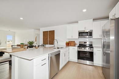 (*Photo of actual model home) Enjoy plenty of storage space in the cabinets