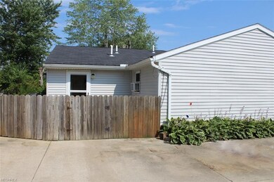 Just beyond the fence is the patio and entrance to