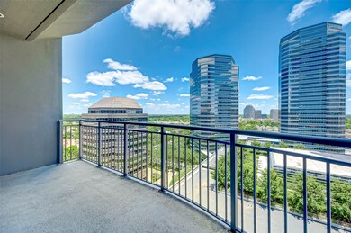 Spacious balcony with stunning cityscape views, featuring modern high-rise buildings and a clear blue sky. Perfect for enjoying outdoor relaxation and entertainment.